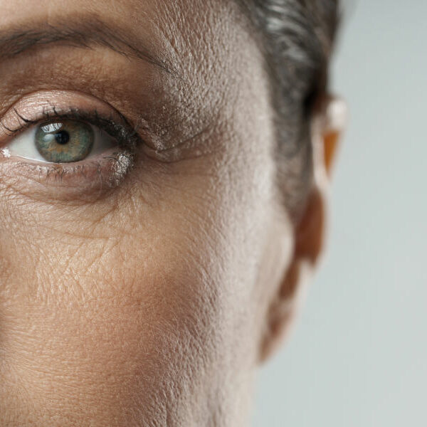 Close-up of aged female eye. Rejuvenation or Ophthalmology concepts.
